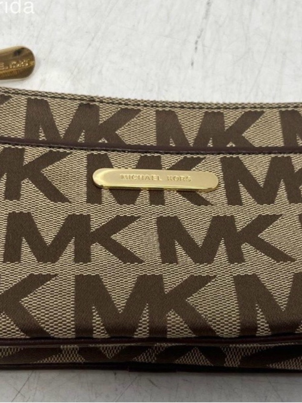 Michael Kors Brown and Tan Signature MK Wristlet with Gold Plate